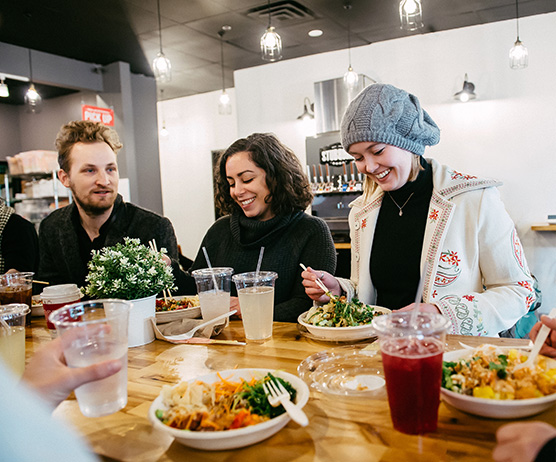 Poke Papa customers eating poke bowls and having a good time at the restaurant